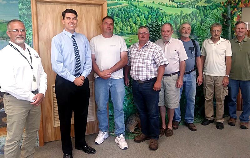 Wayne Conservation District directors congratulate scholarship winner from Wallenpaupack.