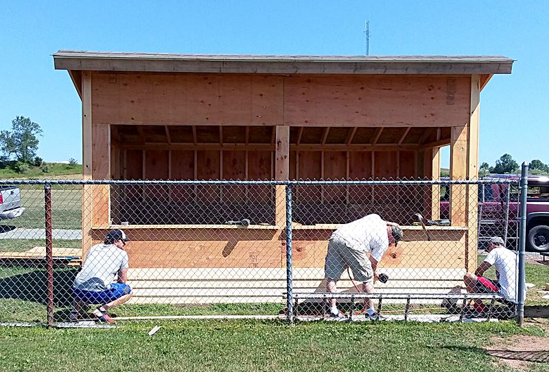 New Home Dugout replaces one tossed by the wind storm back in May.
