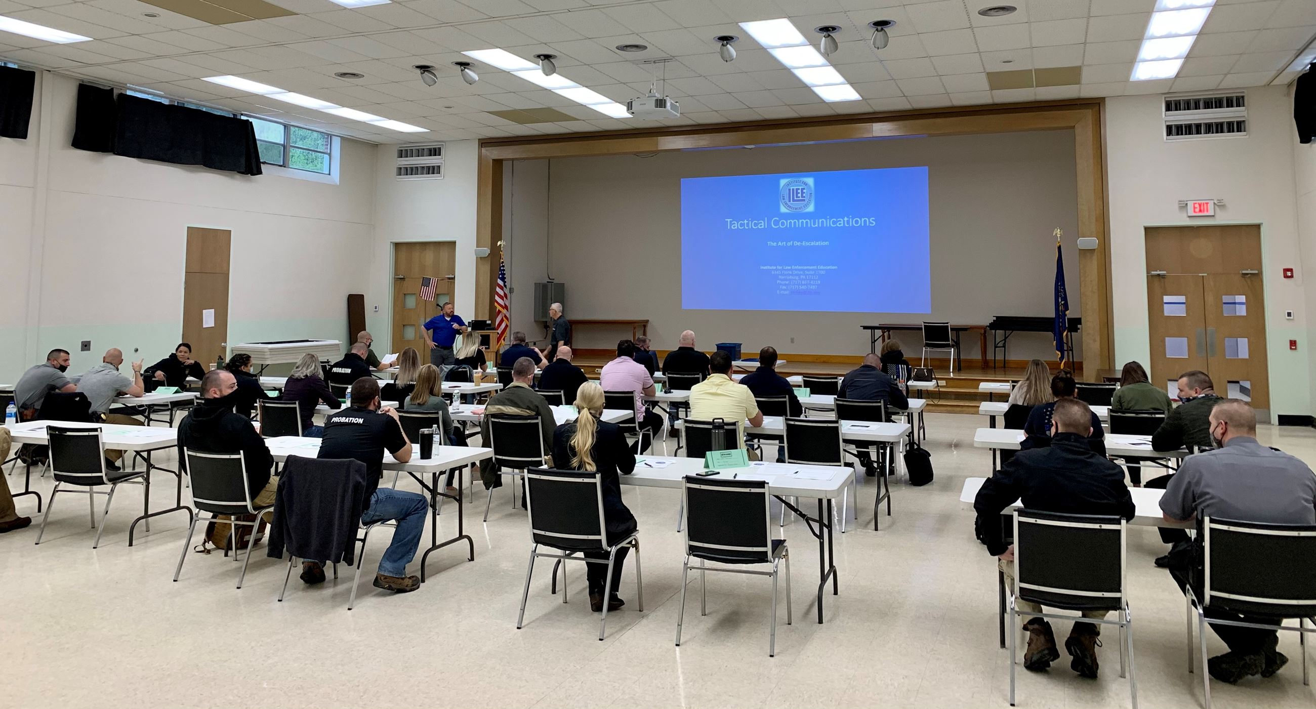 Local officers gather at spaced desks for Tactical Training in the Park Street Cafeteria.