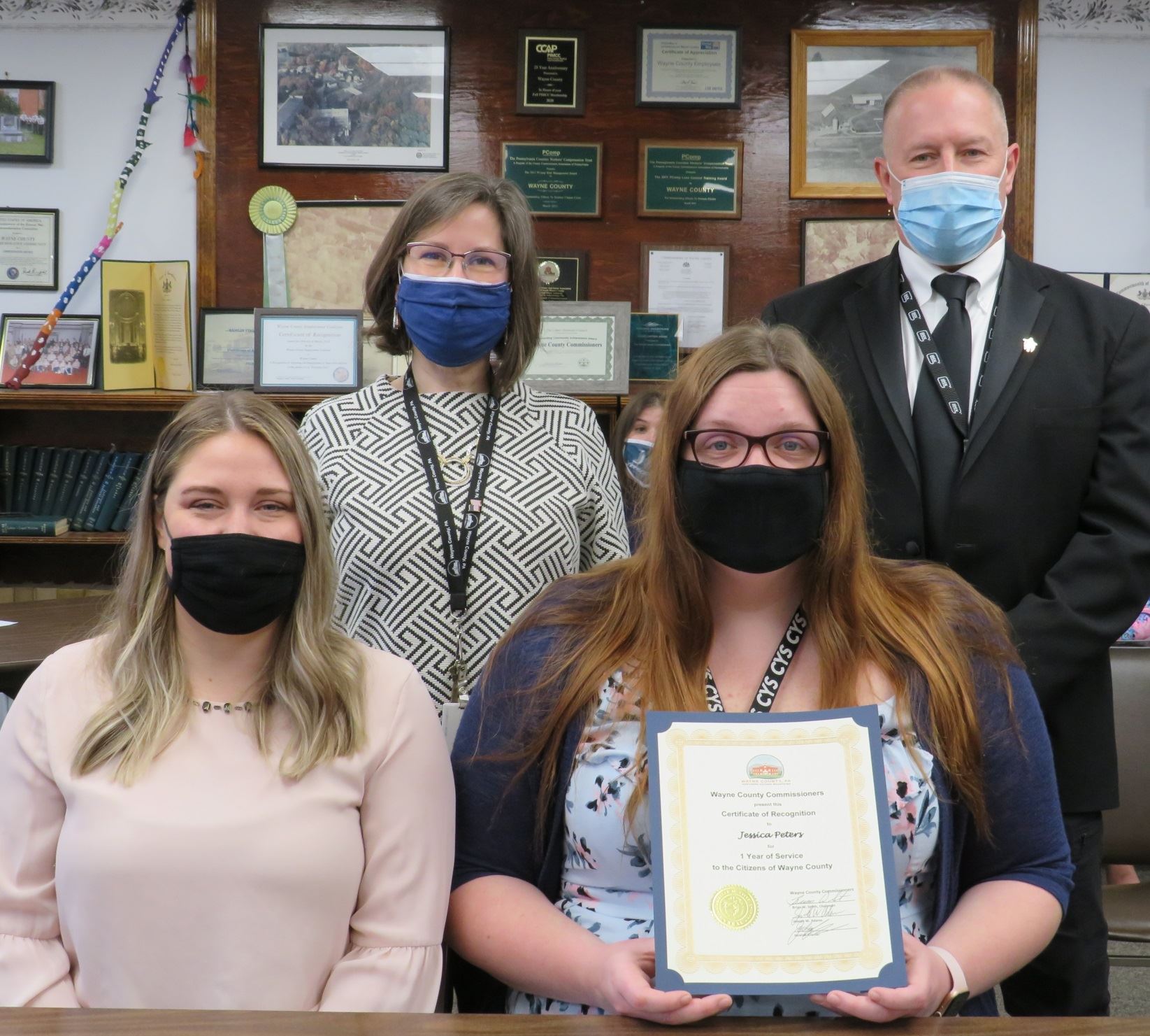 Jessica Peters  with the Commissioners marking one year of service to the people of Wayne County.
