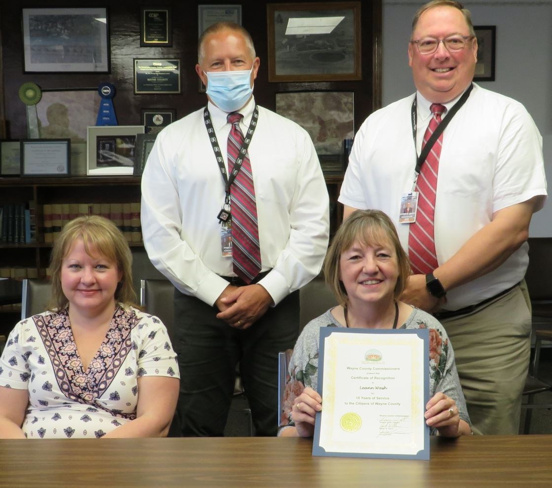 Leann Wash  with the Commissioners marking 15 years of service to the people of Wayne County.