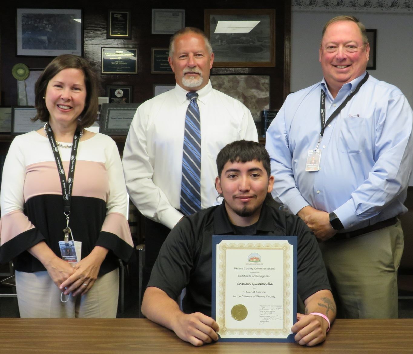 Christian Quintanilla  with the Commissioners marking one year of service to the people of Wayne Cou