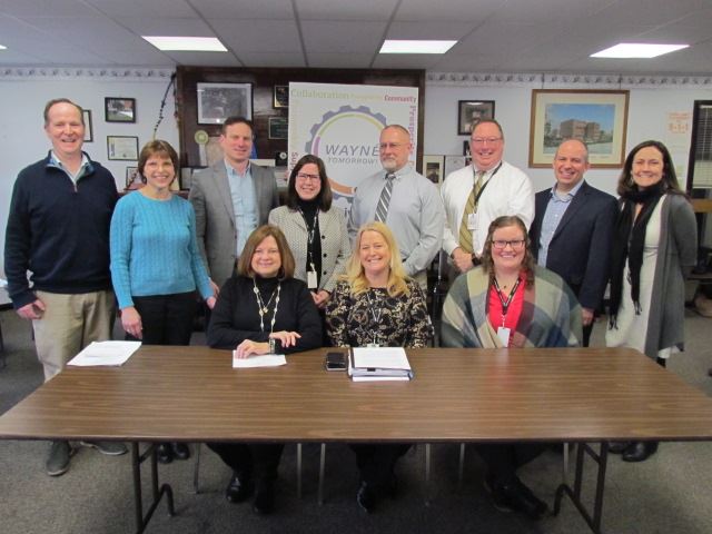 A group representing the local housing industry to mark the adoption of the Act 137 Plan.